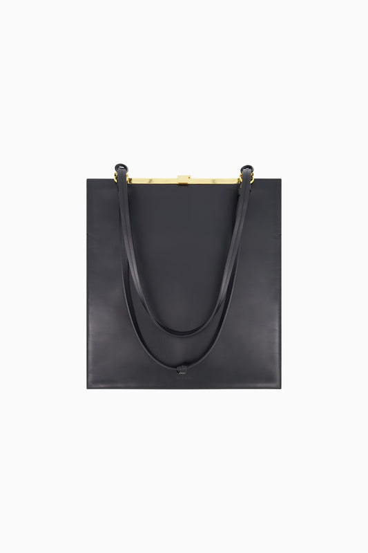 Flat black leather tote with gold hardware.