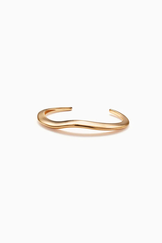 Gold thin organic-shaped bangle.