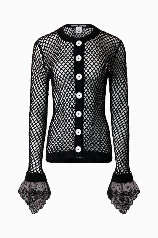 Front view of black net cardigan with white buttons and black lace sleeves.