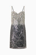 A sleeveless, v-neck rhinestone dress with a knee-length skirt.