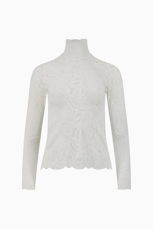 Front view of white lace turtleneck blouse.