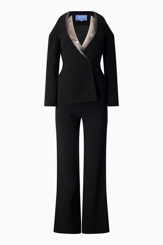 A Thierry Mugler black pantsuit with a sequinned collar.