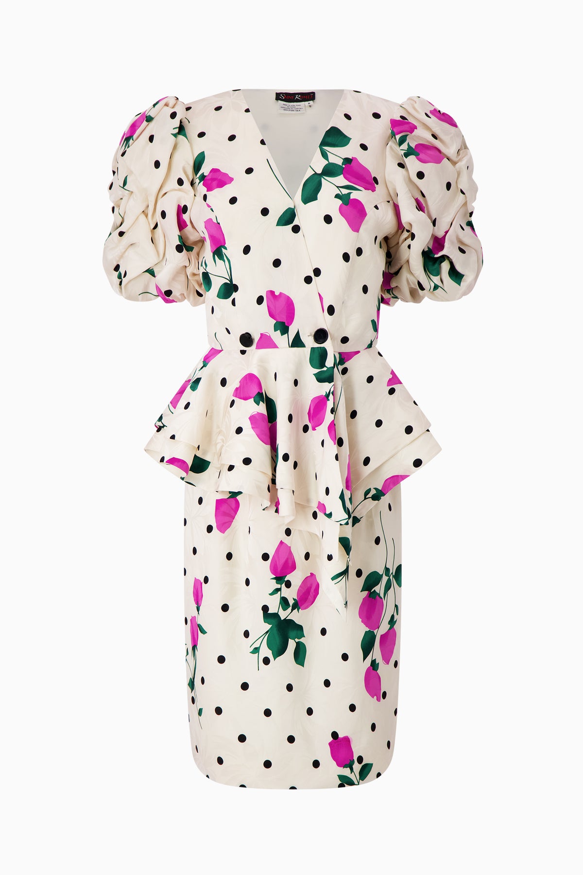 A white suit with a rose print and dotted pattern, featuring a V-neckline and bell sleeves.